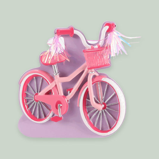 First Bike — Pink ornament on a sage green background