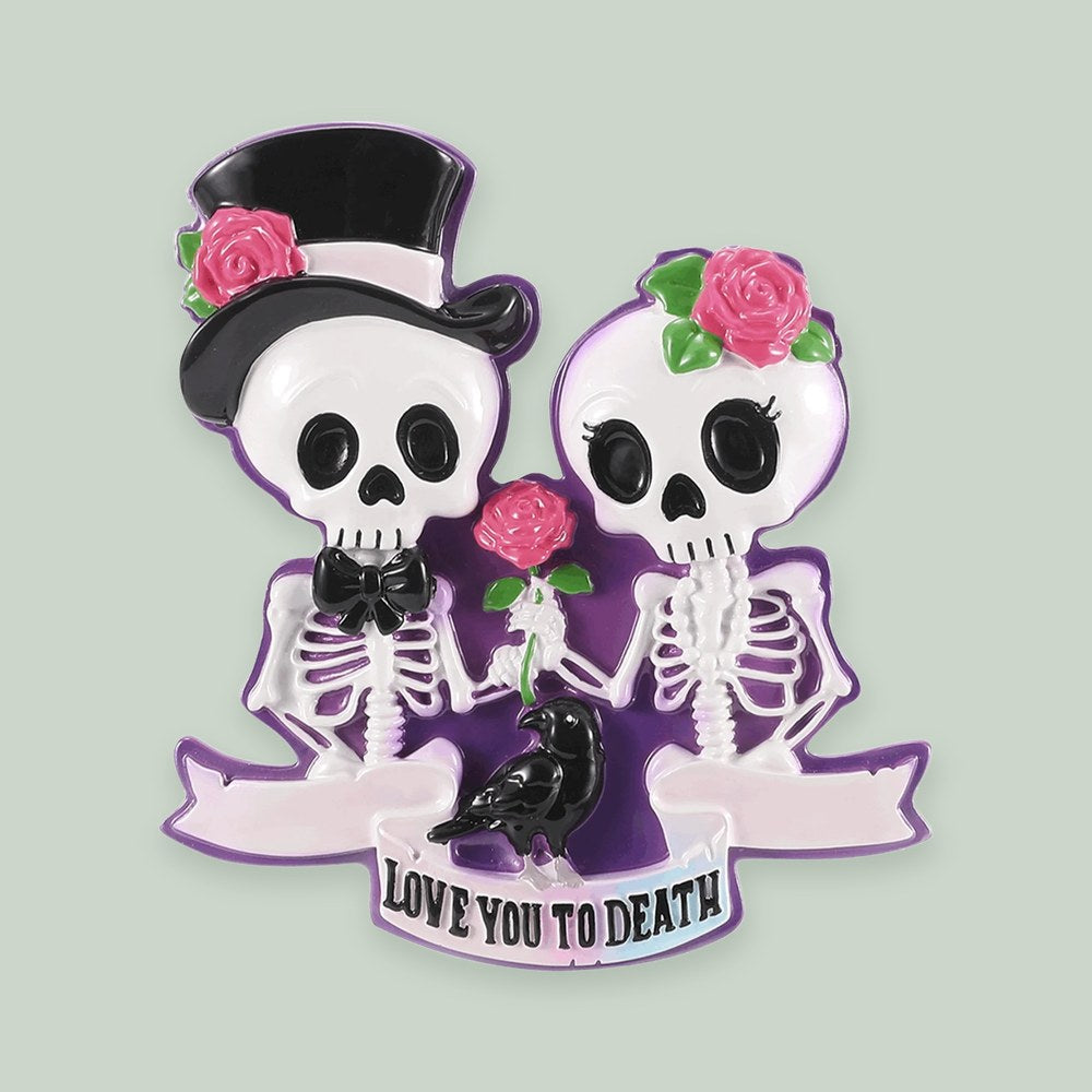 Skeleton Wedding Couple ornament on a sage green background