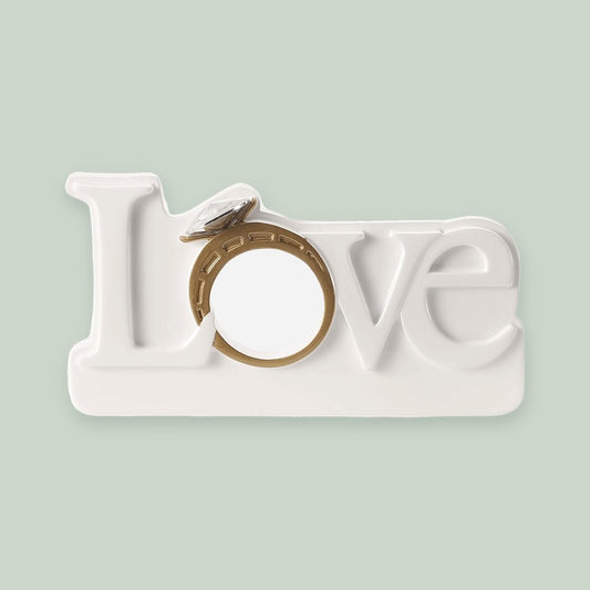 Love with Engagement Ring ornament on a sage green background
