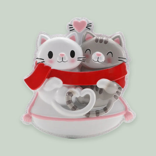 Cat Couple ornament on a sage green background