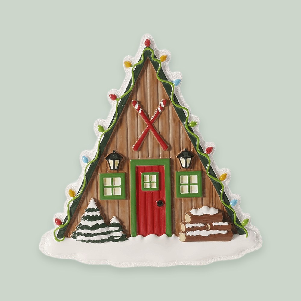 Ski Lodge with Hanging Skis ornament on a sage green background