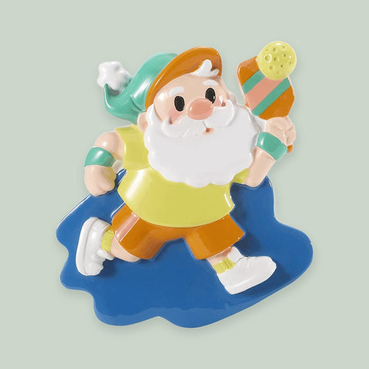 Pickleball Santa ornament on a sage green background