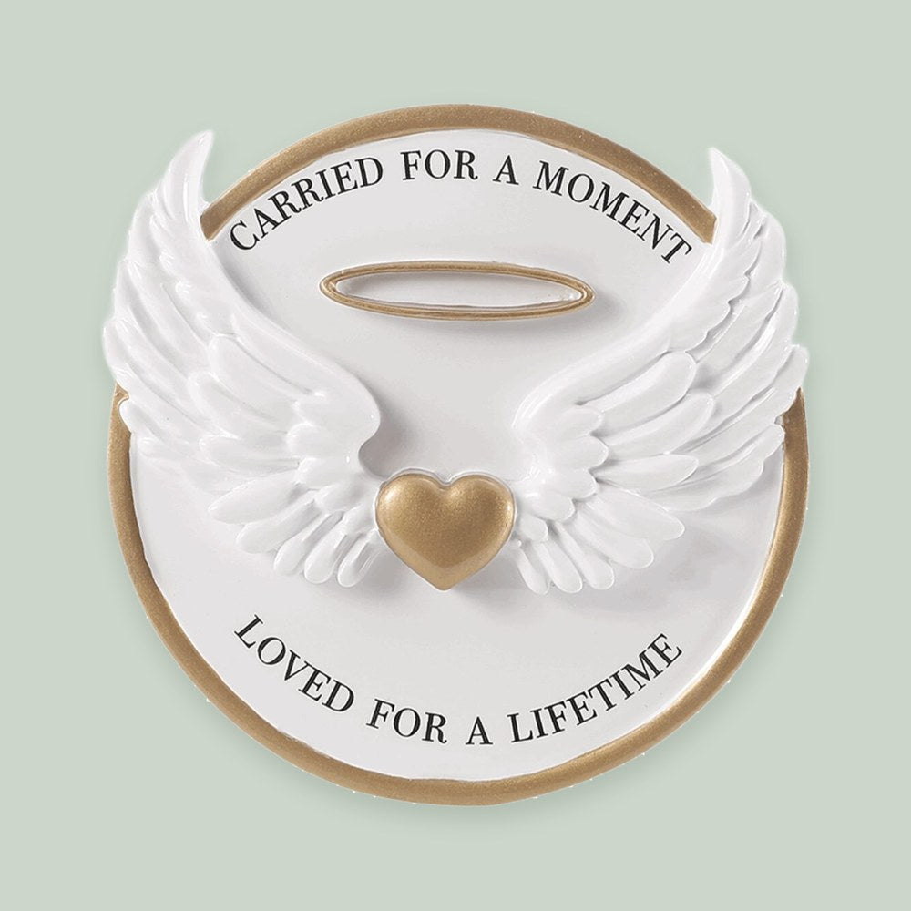Carried for a Moment, Loved for a Lifetime ornament on a sage green background