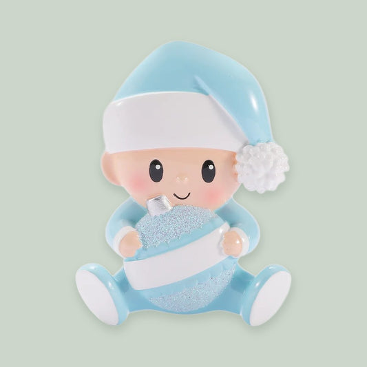 Baby Holding Christmas Bauble — Blue ornament on a sage green background