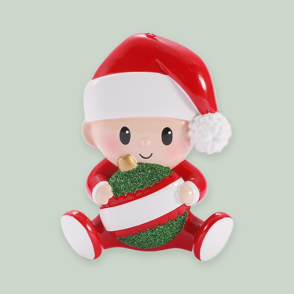 Baby Holding Christmas Bauble — Red and Green ornament on a sage green background