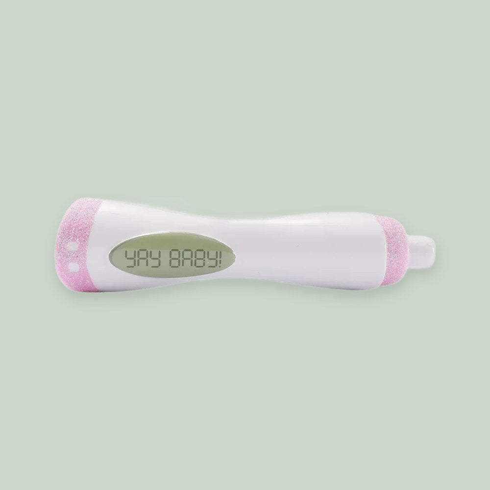 Pregnancy Announcement Test — Pink ornament on a sage green background