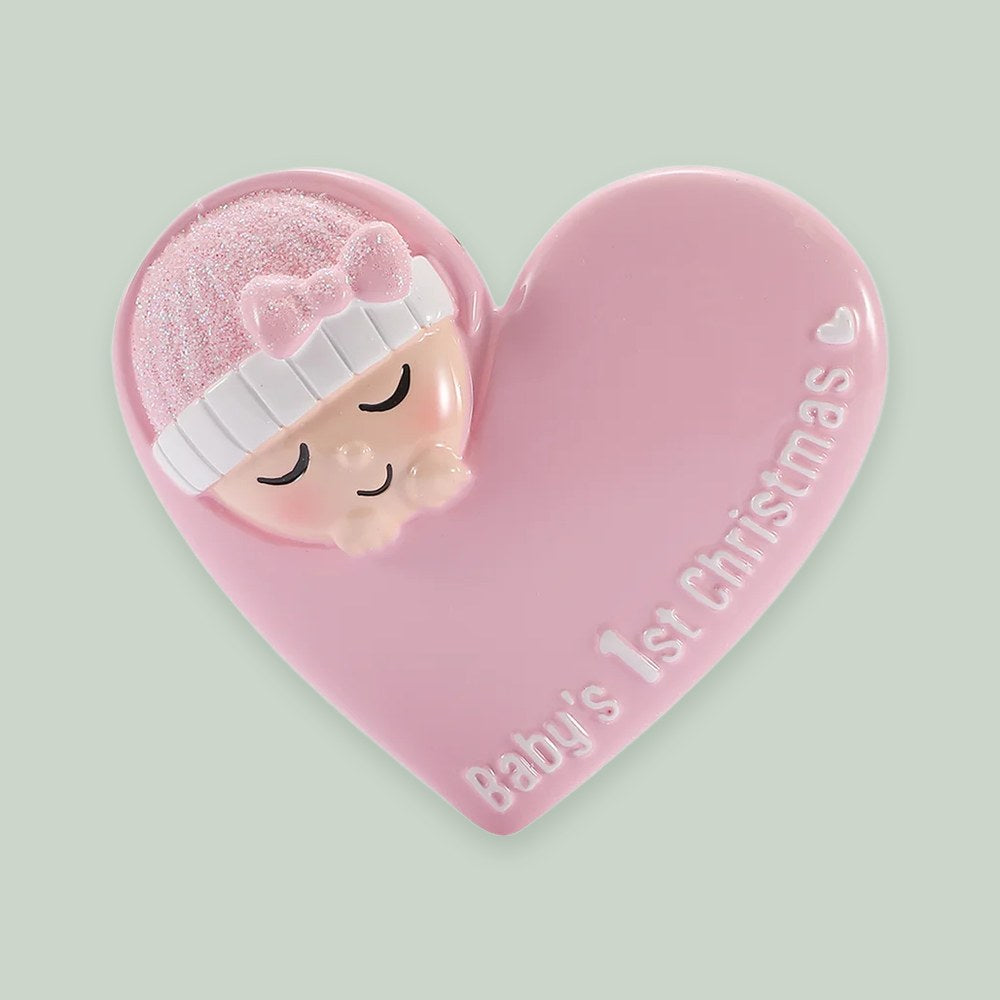 Sleeping Baby in Heart — Pink ornament on a sage green background