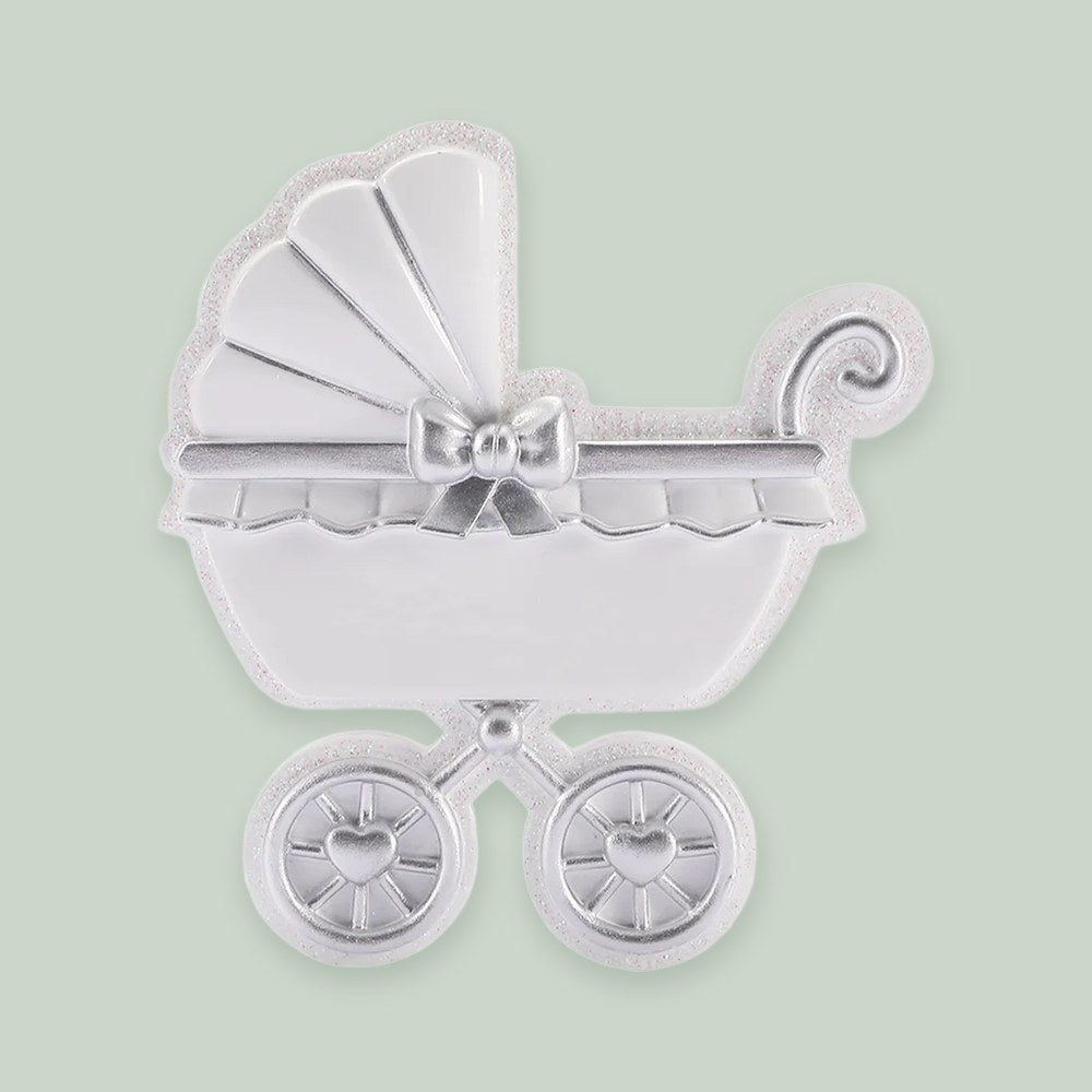 Silver Baby Carriage ornament on a sage green background