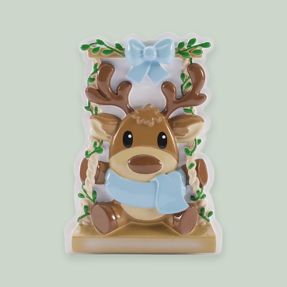 Baby Reindeer on a Garden Swing- Blue ornament on a sage green background