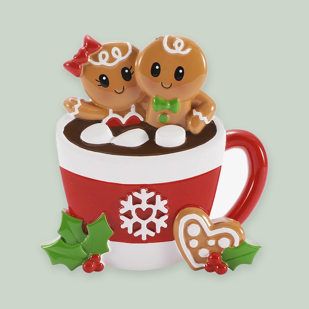 Gingerbread Couple in Hot Cocoa ornament on a sage green background