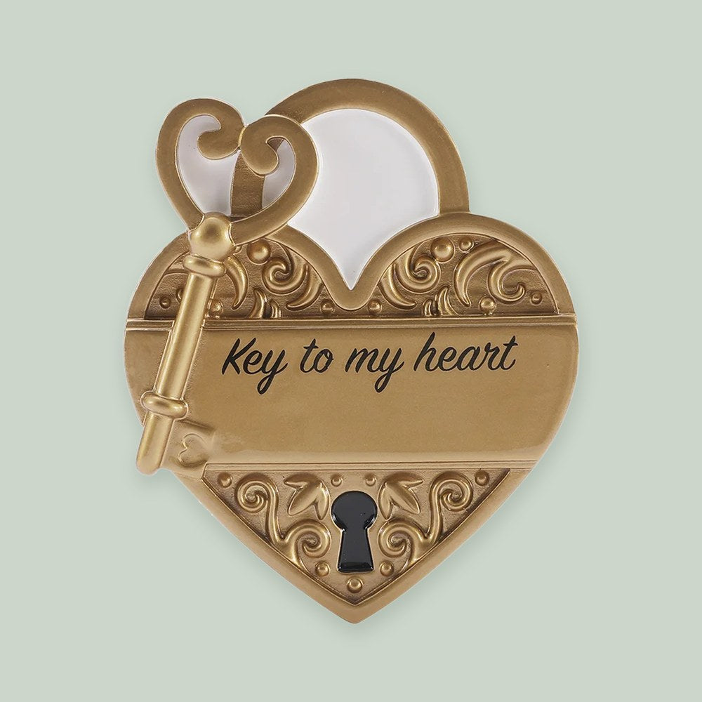 Key to My Heart ornament on a sage green background
