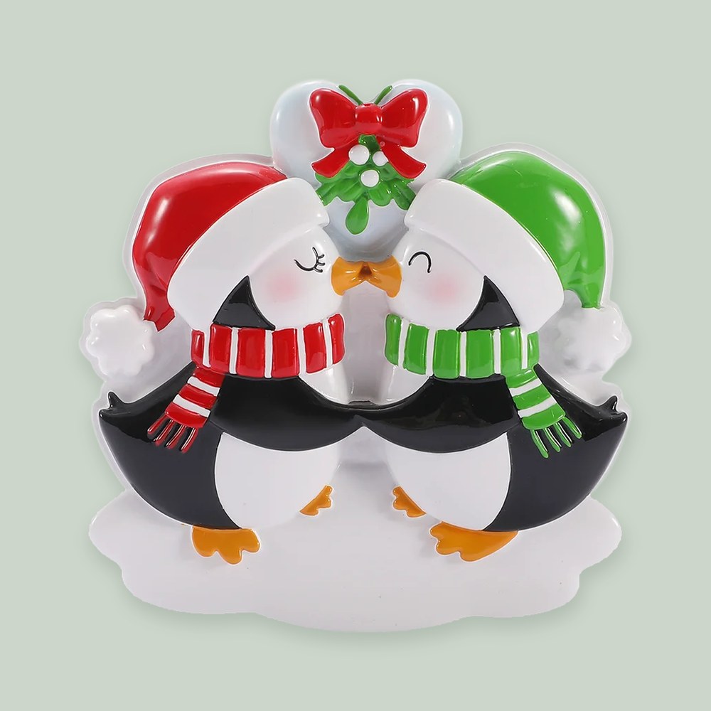 Kissing Penguins with Mistletoe ornament on a sage green background
