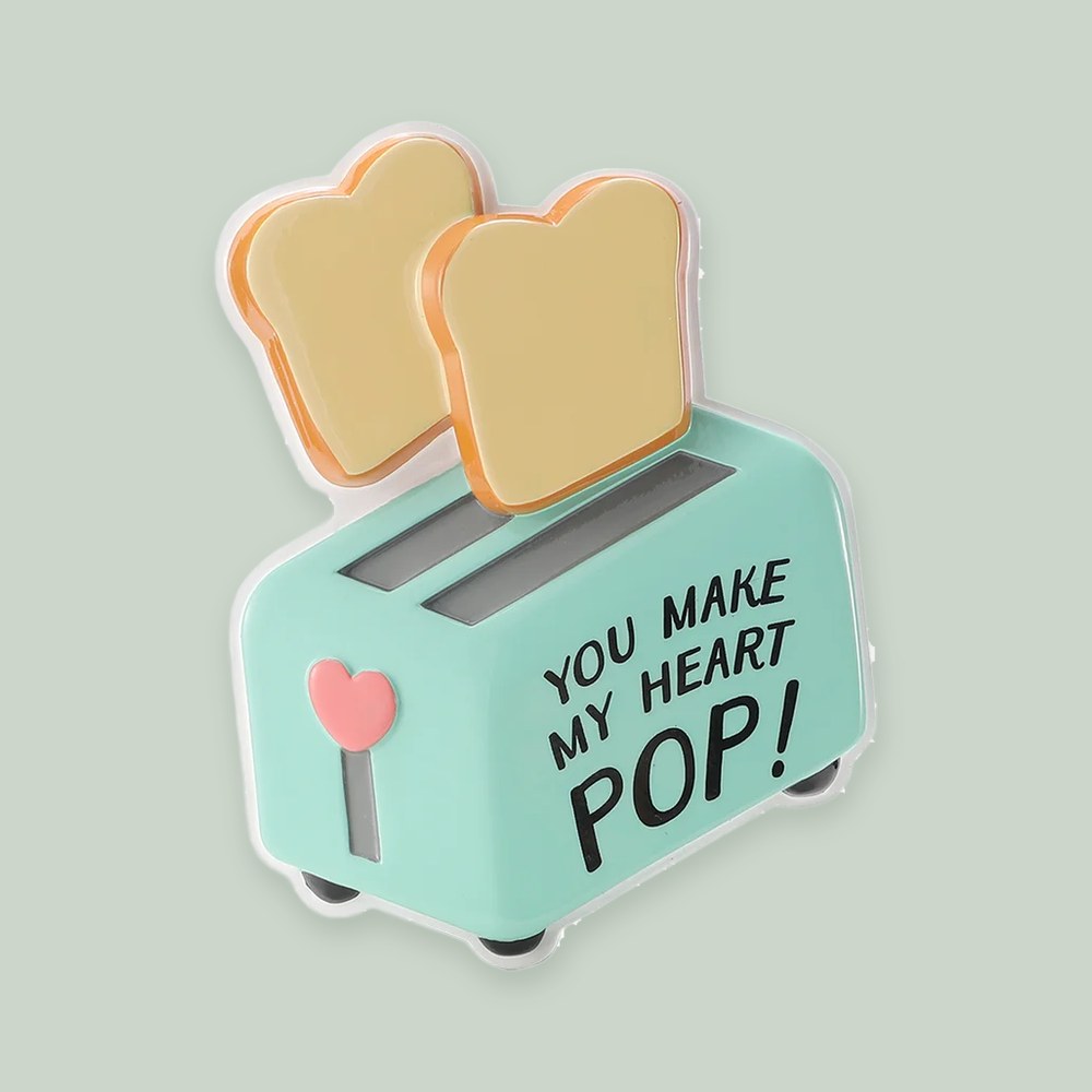 You Make My Heart Pop Toaster ornament on a sage green background