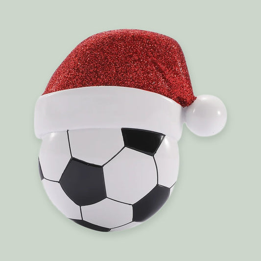 Soccer Ball with Santa Hat ornament on a sage green background