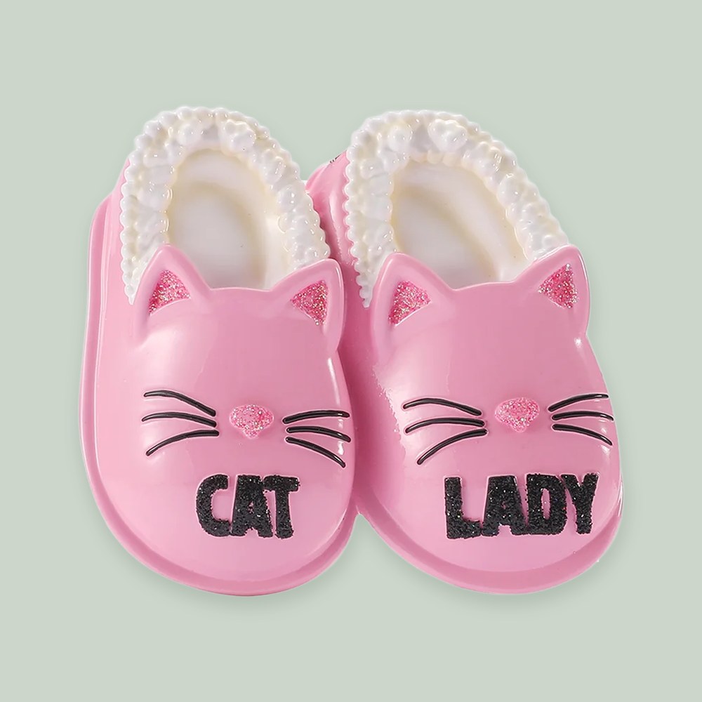Pink Cat Lady Slippers ornament on a sage green background