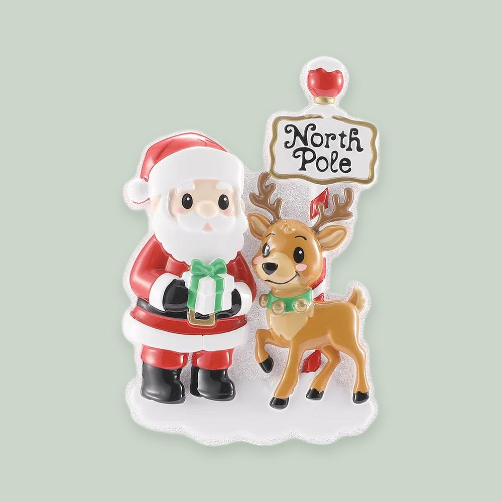 Santa And His Reindeer At The North Pole ornament on a sage green background
