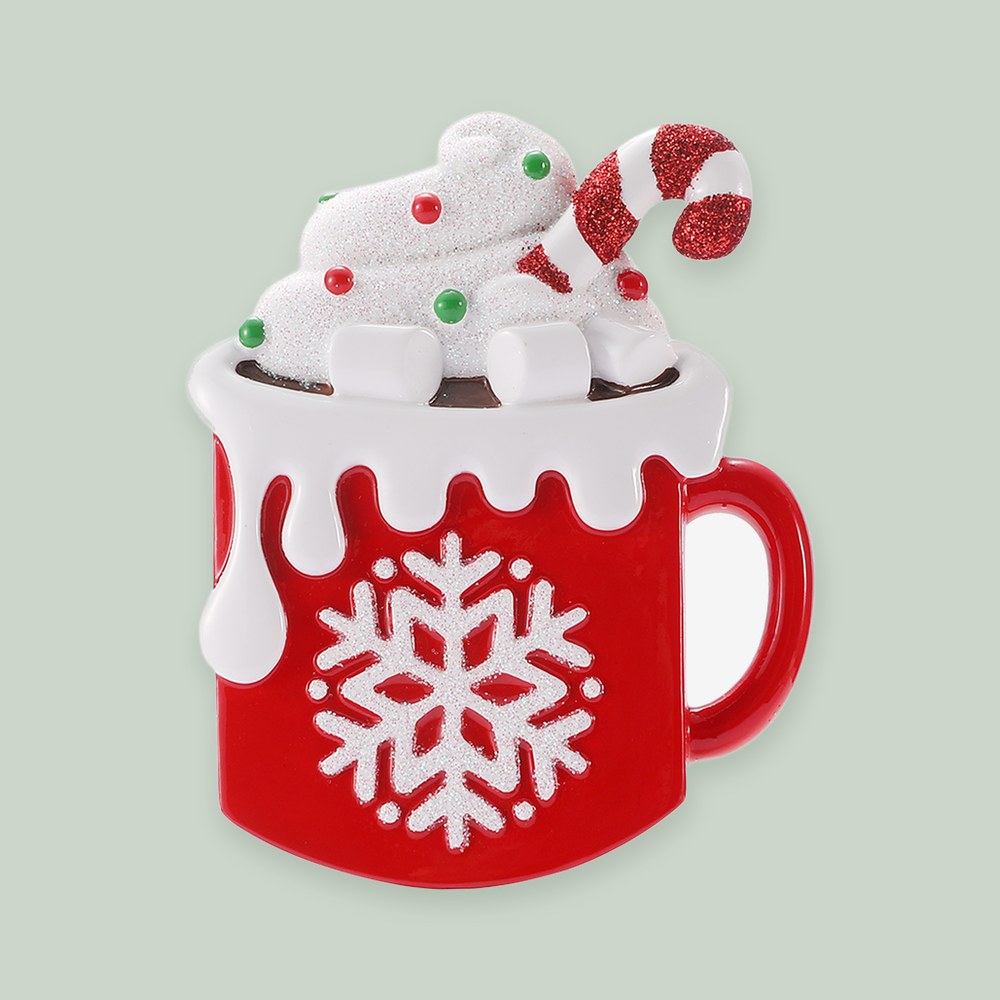 Holiday Hot Cocoa Money Holder ornament on a sage green background