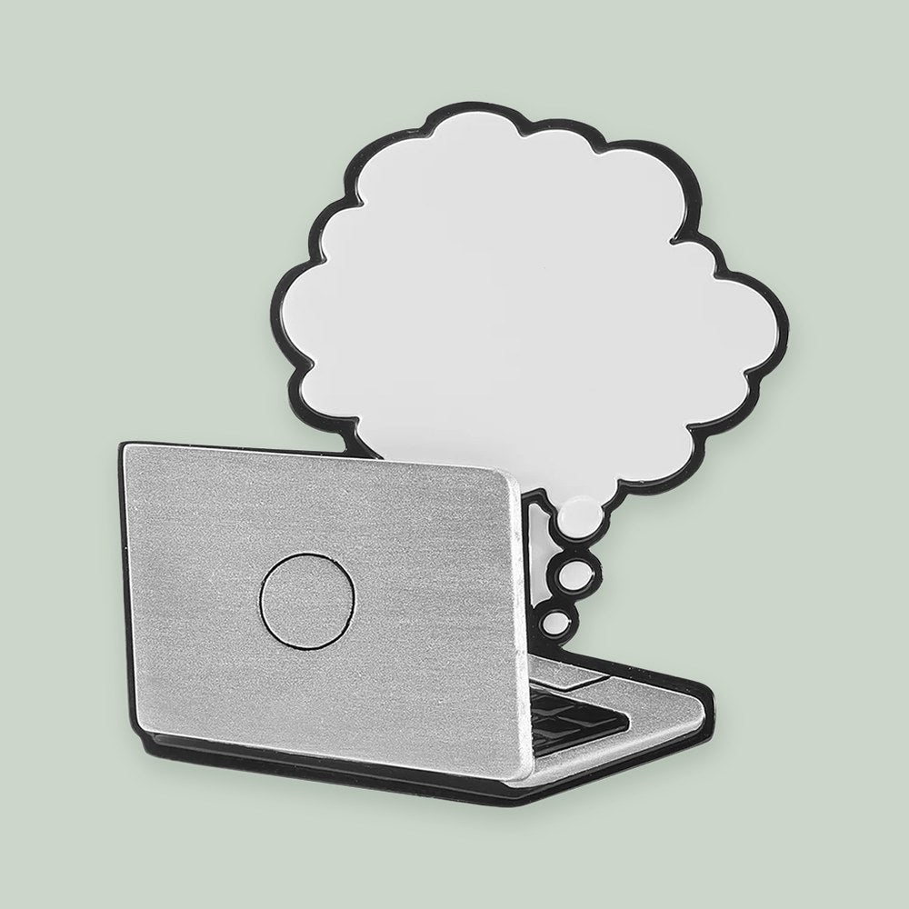 Laptop with Thought Bubble ornament on a sage green background