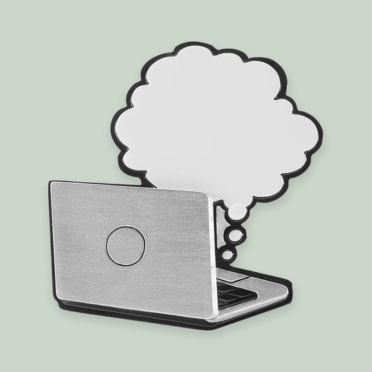 Laptop with Thought Bubble ornament on a sage green background