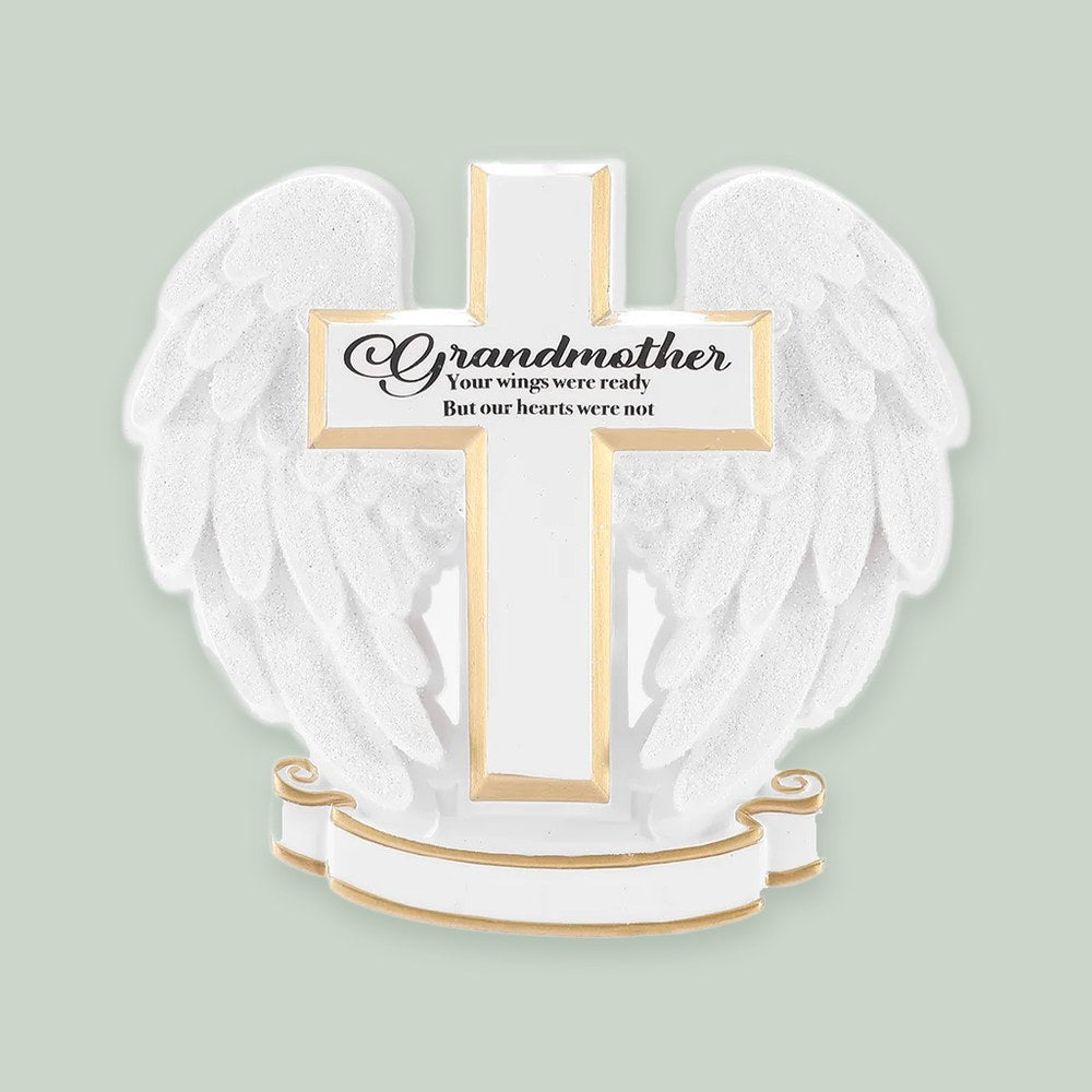 Memorial Cross with Angel Wings ornament on a sage green background