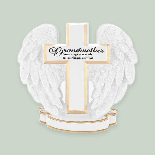 Memorial Cross with Angel Wings ornament on a sage green background