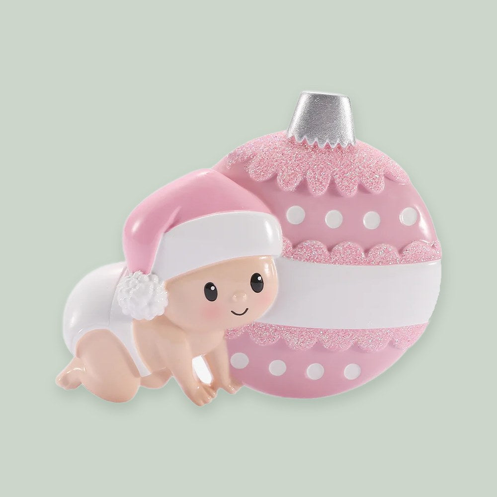 Baby Crawling Ornament- Pink ornament on a sage green background