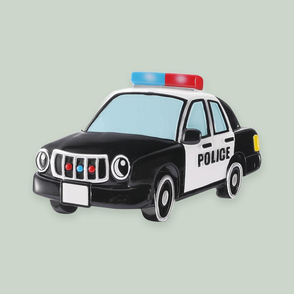 Police Squadcar With Headlight Eyes ornament on a sage green background