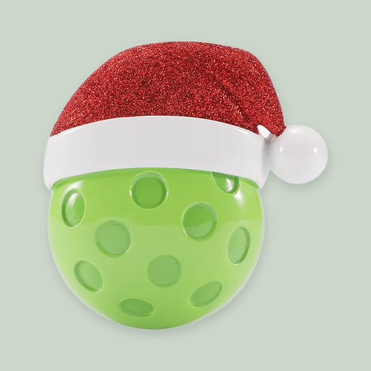 Pickleball with Santa Hat ornament on a sage green background