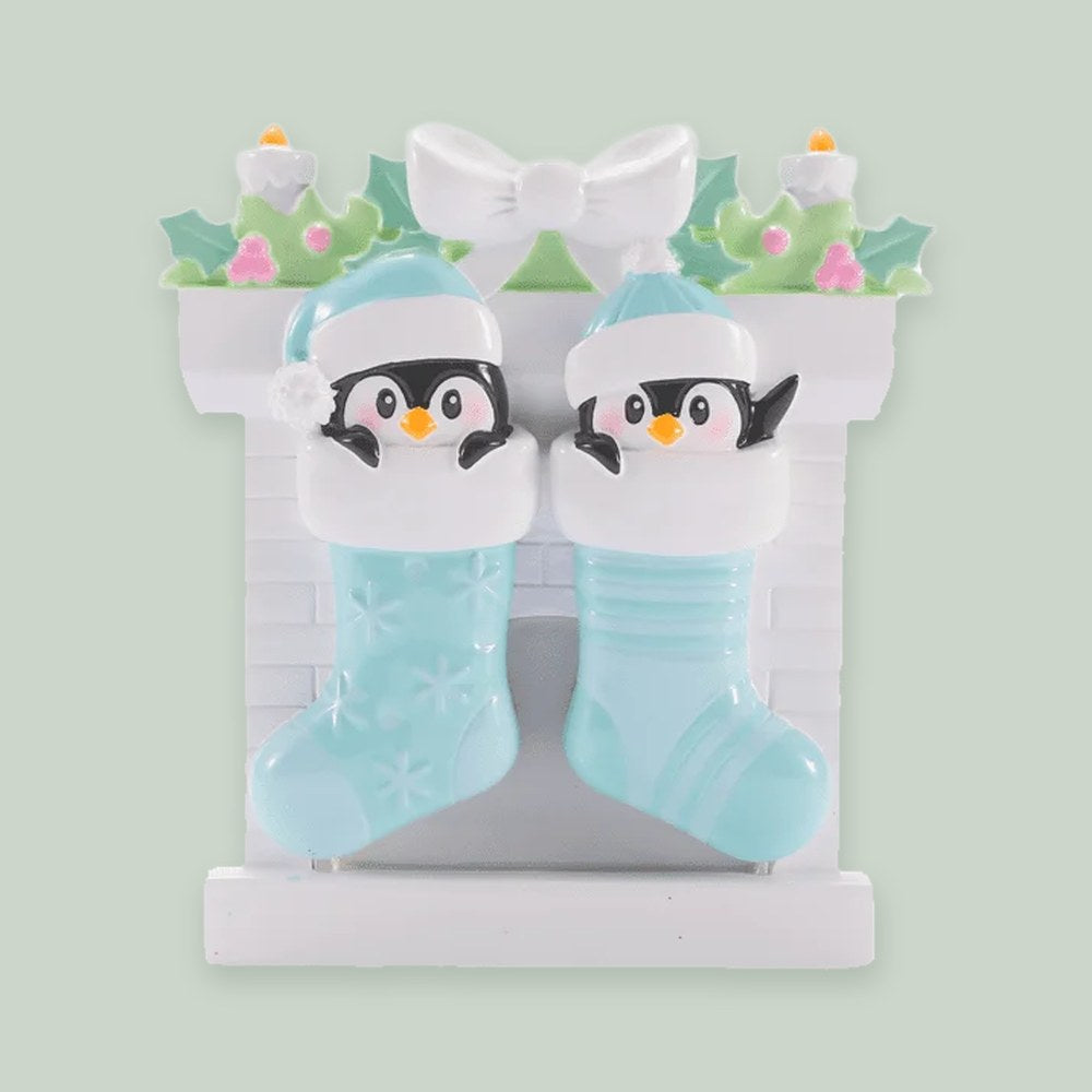 Twin Baby Penguins in Stockings — Boys ornament on a sage green background