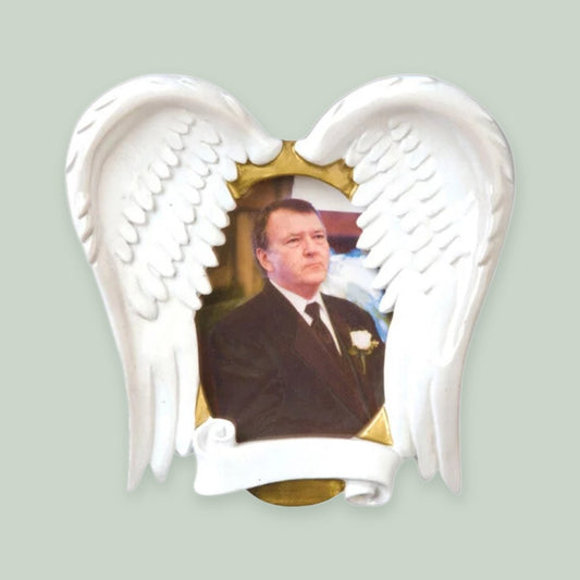 In Loving Memory Angel Wings Photo Frame ornament on a sage green background